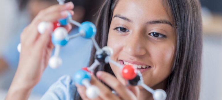KS2 pupils taking part in a practical science activity during a primary lesson